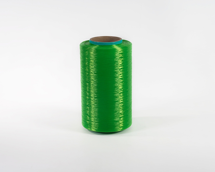 High strength and low shrinkage colored polyester filament